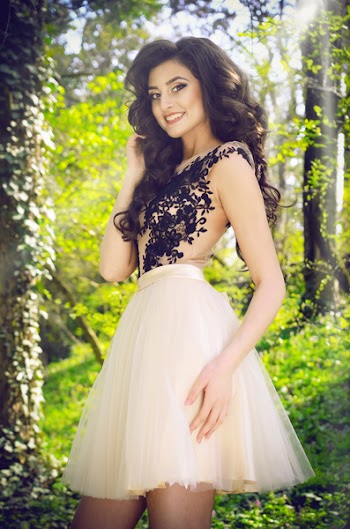 Woman Wearing White and Black Lace Sleeveless Mini Dress