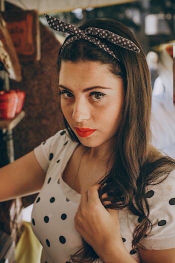 Woman Wearing White And Black Polka Dot Crew Neck Top
