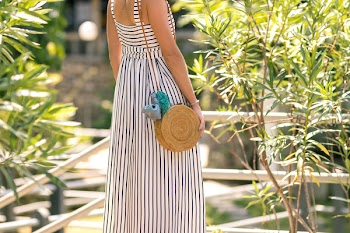 Woman Wearing White And Black Striped Sleeveless Maxi Dress 