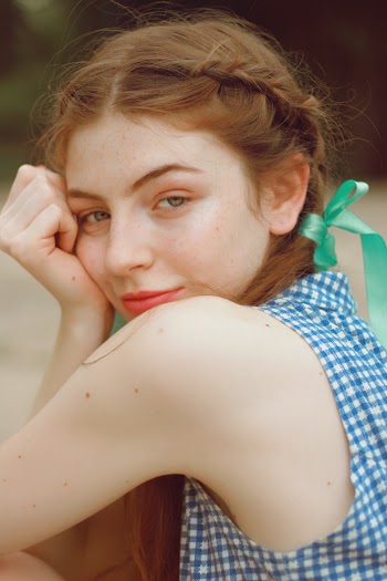 Woman Wearing White and Blue Sleeveless Top