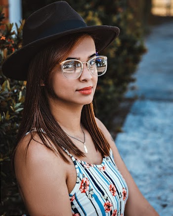 Woman Wearing White-and-blue Striped Floral Tank Dress and Black Hat