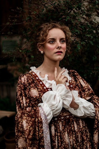 Woman Wearing White and Brown Floral Ruffled Victorian Dress