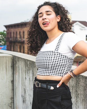 Woman Wearing White and Gray Crop Top Showing Tongue