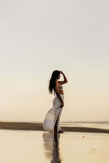 Woman Wearing White and Multicolored Dress
