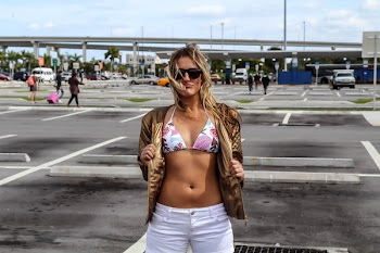 Woman Wearing White and Pink Floral Bikini Top and White Shorts