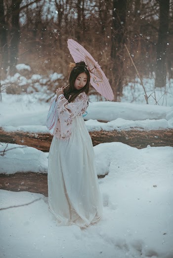 Woman Wearing White and Pink Floral Kimono Dress
