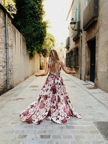 Woman Wearing White and Pink Floral Maxi Dress Standing on Alley