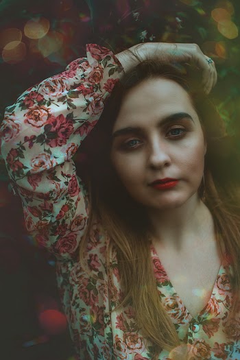 Woman Wearing White and Red Floral Long-sleeved Shirt