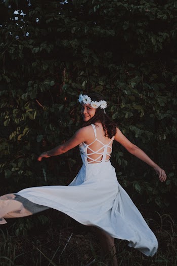 Woman Wearing White Backless Dress Dancing