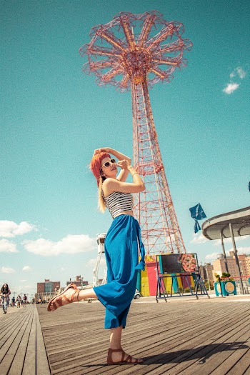 Woman Wearing White, Black, and Blue Sleeveless Top