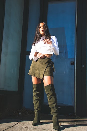 Woman Wearing White Blouse And Miniskirt