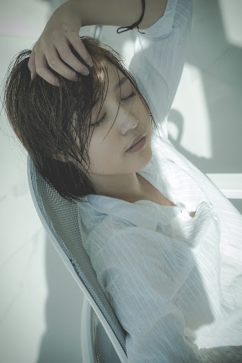 Woman Wearing White Blouse Sitting on Chair