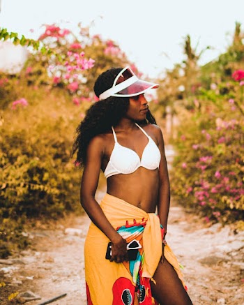 Woman Wearing White Bra and Red-white Visor