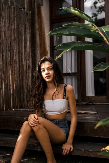 Woman Wearing White Bra Sitting on Stair