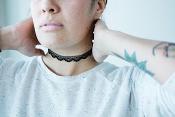 Woman Wearing White Crew-neck T-shirt and Black Choker Necklace