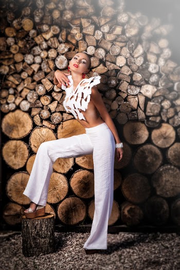Woman Wearing White Crop-top Standing Beside Tree Slabs
