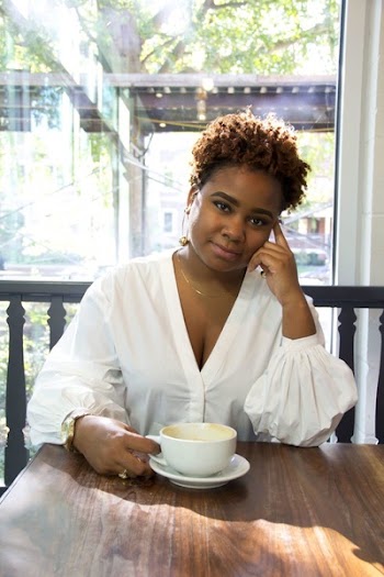 Woman Wearing White Deep V-neck Long-sleeved Blouse Holding White Ceramic Teacup