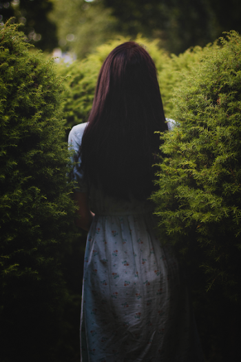 Woman Wearing White Dress Near Green Plants