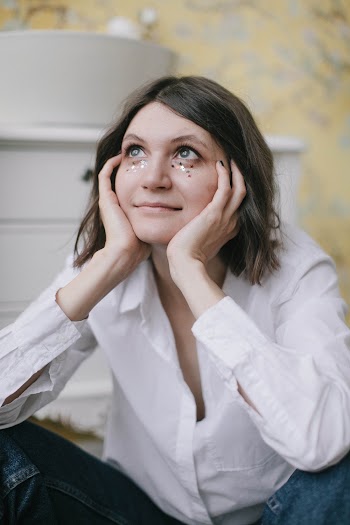 Woman Wearing White Dress Shirt and Blue Denim Bottoms