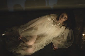 Woman Wearing White Dress Sitting on Floor