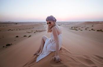 Woman Wearing White Dress Sitting on Sand