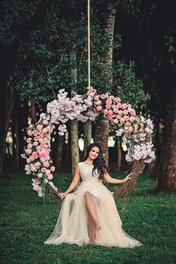 Woman Wearing White Dress Sitting On Swing
