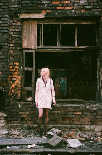 Woman Wearing White Dress Standing Beside Concrete Wall