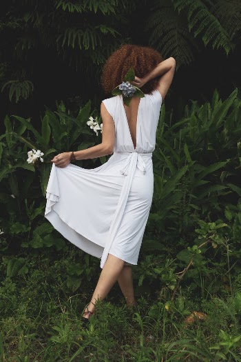 Woman Wearing White Dress Standing Beside Plant