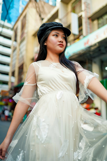 Woman Wearing White Dress With Black Hat