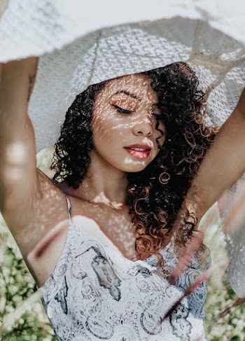 Woman Wearing White Floral Lace Sleeveless Top