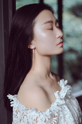 Woman Wearing White Floral Off-shoulder Top