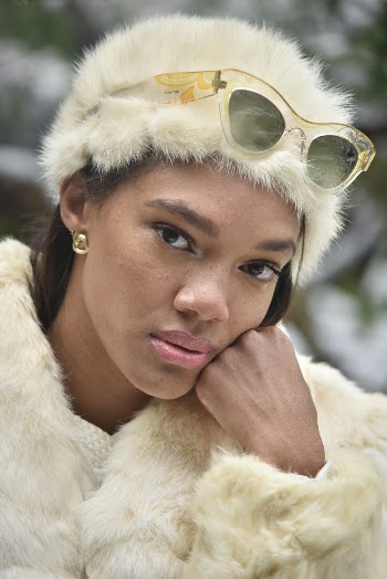 Woman Wearing White Fur Coat With Sunglasses