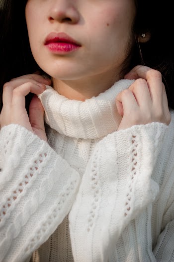 Woman Wearing White Knitted Sweater