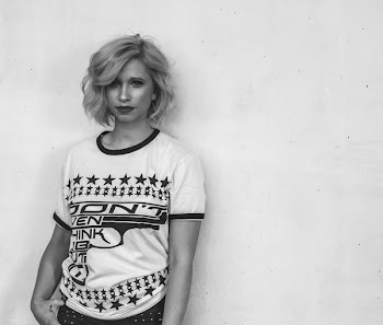 Woman Wearing White Labeled Shirt in Grayscale Photography