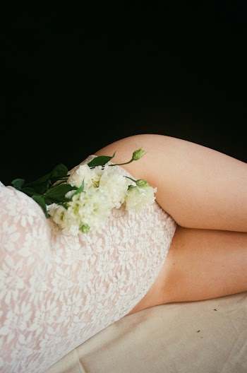 Woman Wearing White Lace body suit
