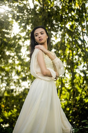Woman Wearing White Lace Long-sleeved Dress 