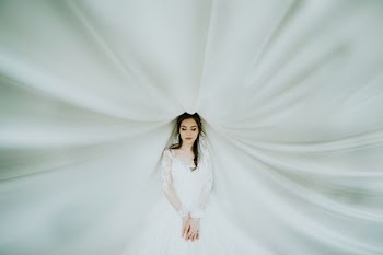 woman wearing white long-sleeved dress