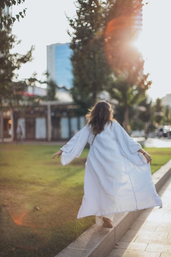 Woman Wearing White Long-sleeved Gown