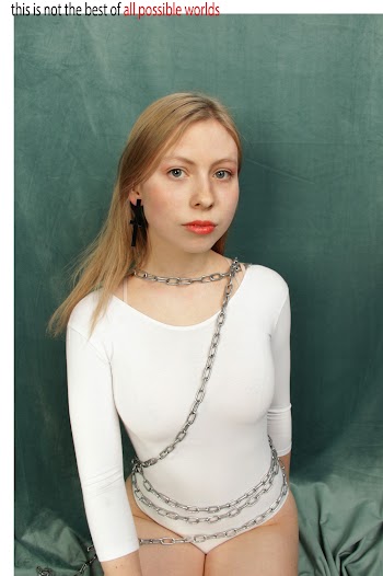 Woman Wearing White Long-sleeved Onepiece With Gray Steel Chains
