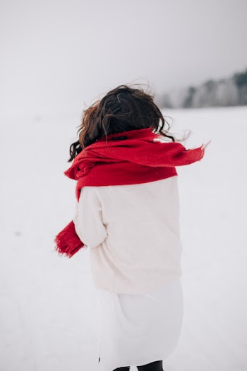 Woman Wearing White Long-sleeved Shirt Standing on Snow