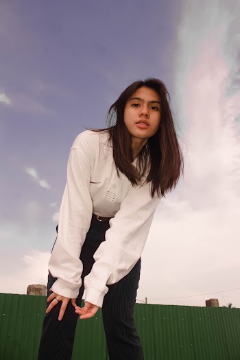 Woman Wearing White Long-sleeved Top and Black Pants