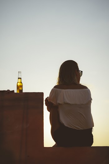 Woman Wearing White Off-shoulder Blouse