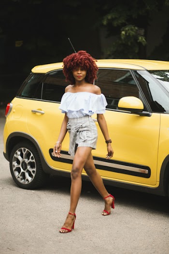 Woman Wearing White Off-shoulder Blouse Standing Next To Yellow Fiat 500l 