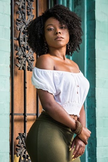 Woman Wearing White Off-shoulder Shirt and Green Bottoms