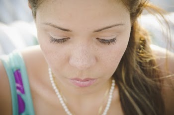Woman Wearing White Pearl Necklace 