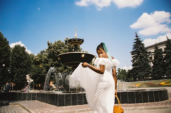 Woman Wearing White Pleated Dress