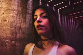 Woman Wearing White Scoop-neck Sleeveless Top and Black Choker Necklace