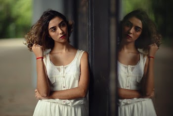 Woman Wearing White Scoop-neck Tank Dress With Reflection to Mirror