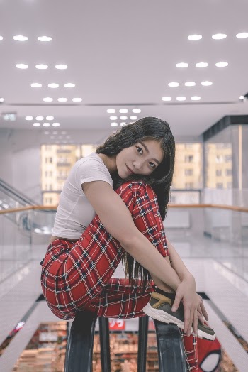 Woman Wearing White Shirt And Checkered Pants