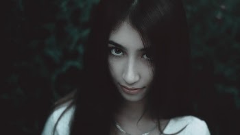 Woman Wearing White Shirt and Silver Chain Necklace
